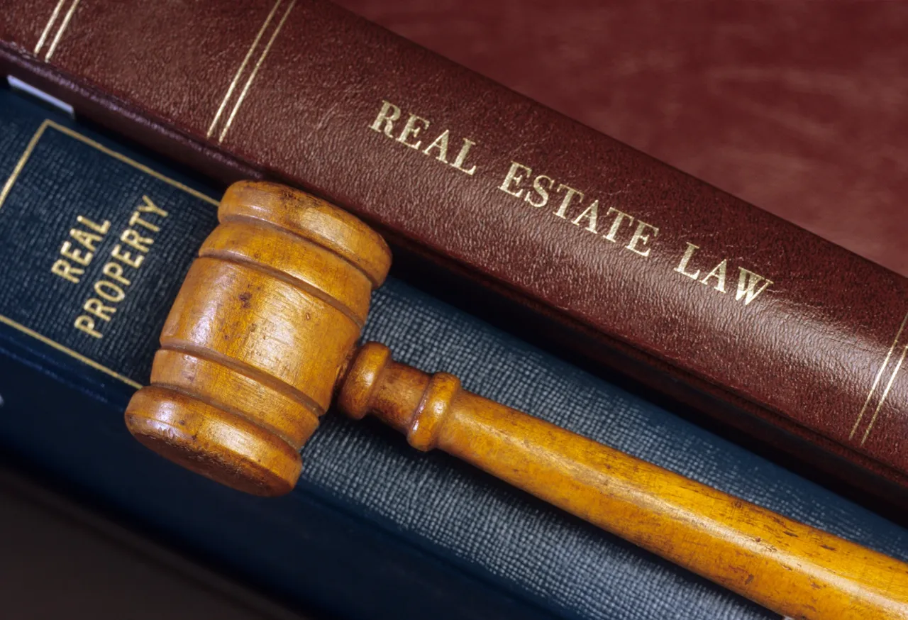 A gavel with real estate law books