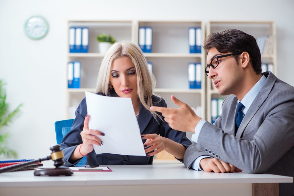 Man and women reviewing the legal papers