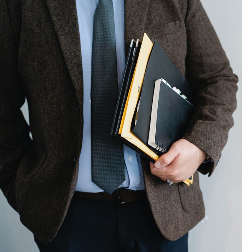 A lawyer holding a documents