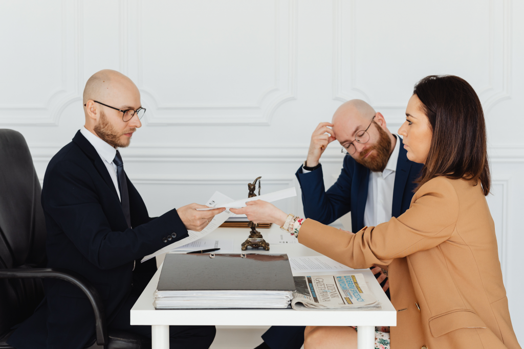 a man talking to couple