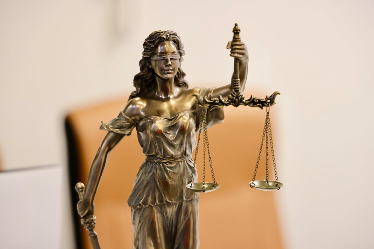 Lady Justice, signifying the legal requirements for process servers