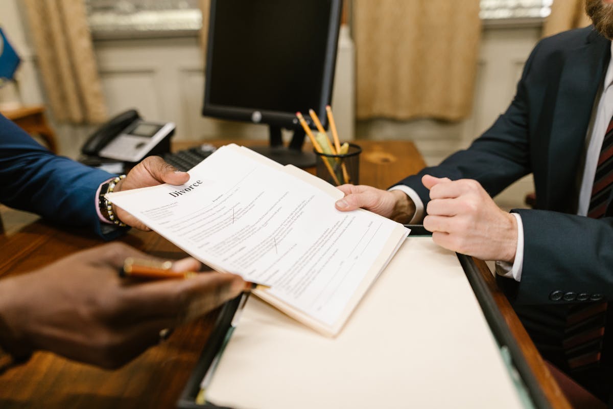 a person handing a divorce decree to a court process server