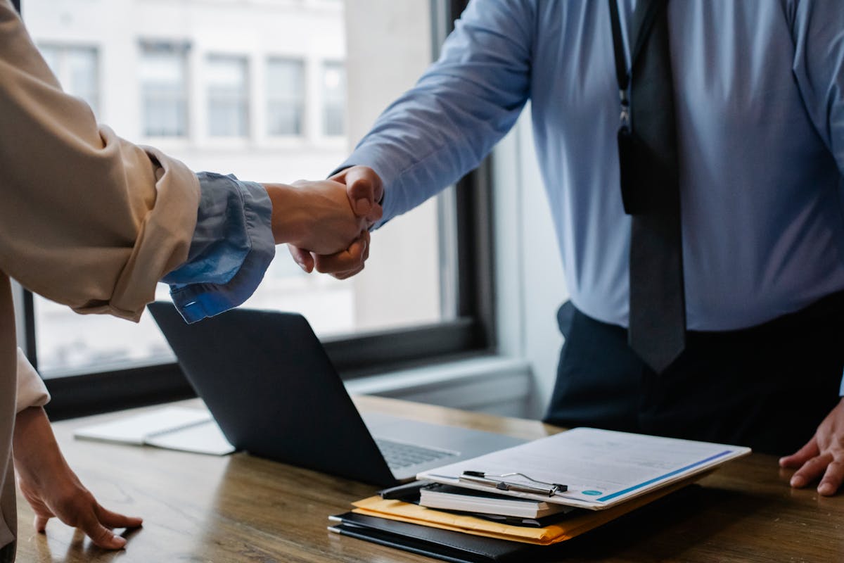 people handshaking, illustrating someone hiring a process server in Los Angeles, California