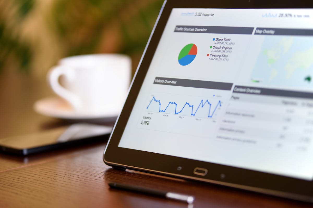 A tablet displaying colorful analytics and charts, showcasing performance insights for process server software.