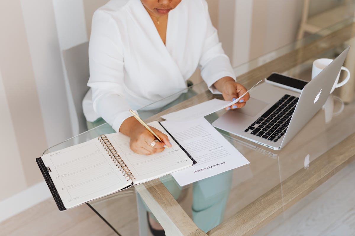Process server managing and organizing legal documents at a desk