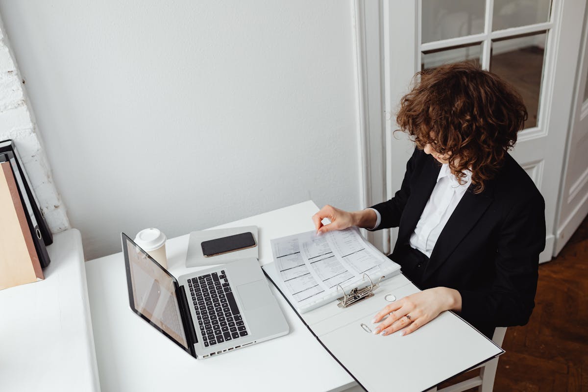 Process server reviewing legal documents in an office setting